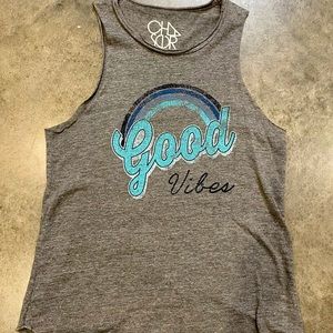 Chaser muscle tank.  Rounded at the bottom.  Worn a few times!